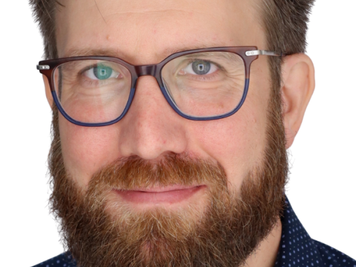 Headshot of Ahren Grebner, a staff clinician at the Student Health Center